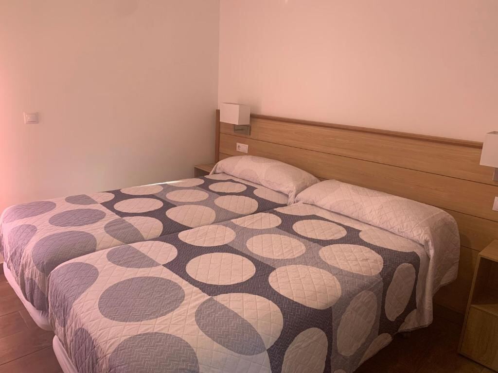 Twin beds in a double room at ALOJAMIENTOS AGAVE