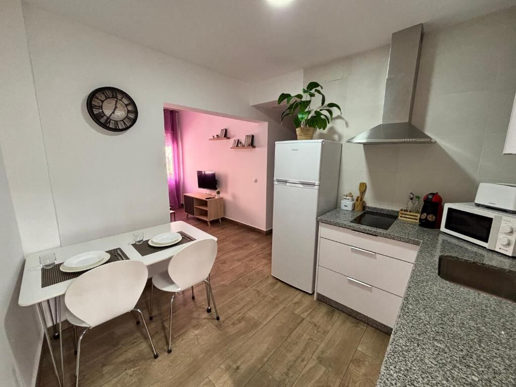 Private kitchen with dining table in a studio apartment